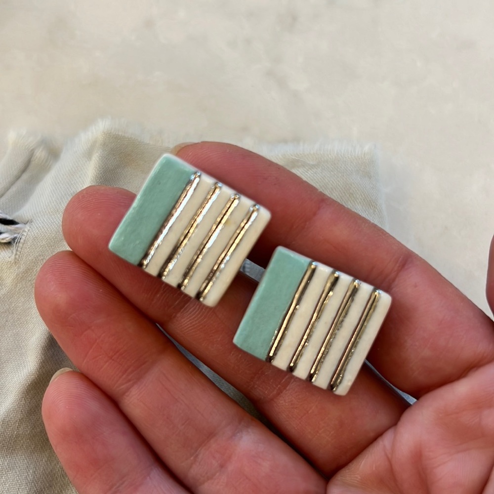 Ceramic cufflinks with silver and turquoise painted stripes by Amber e Lea